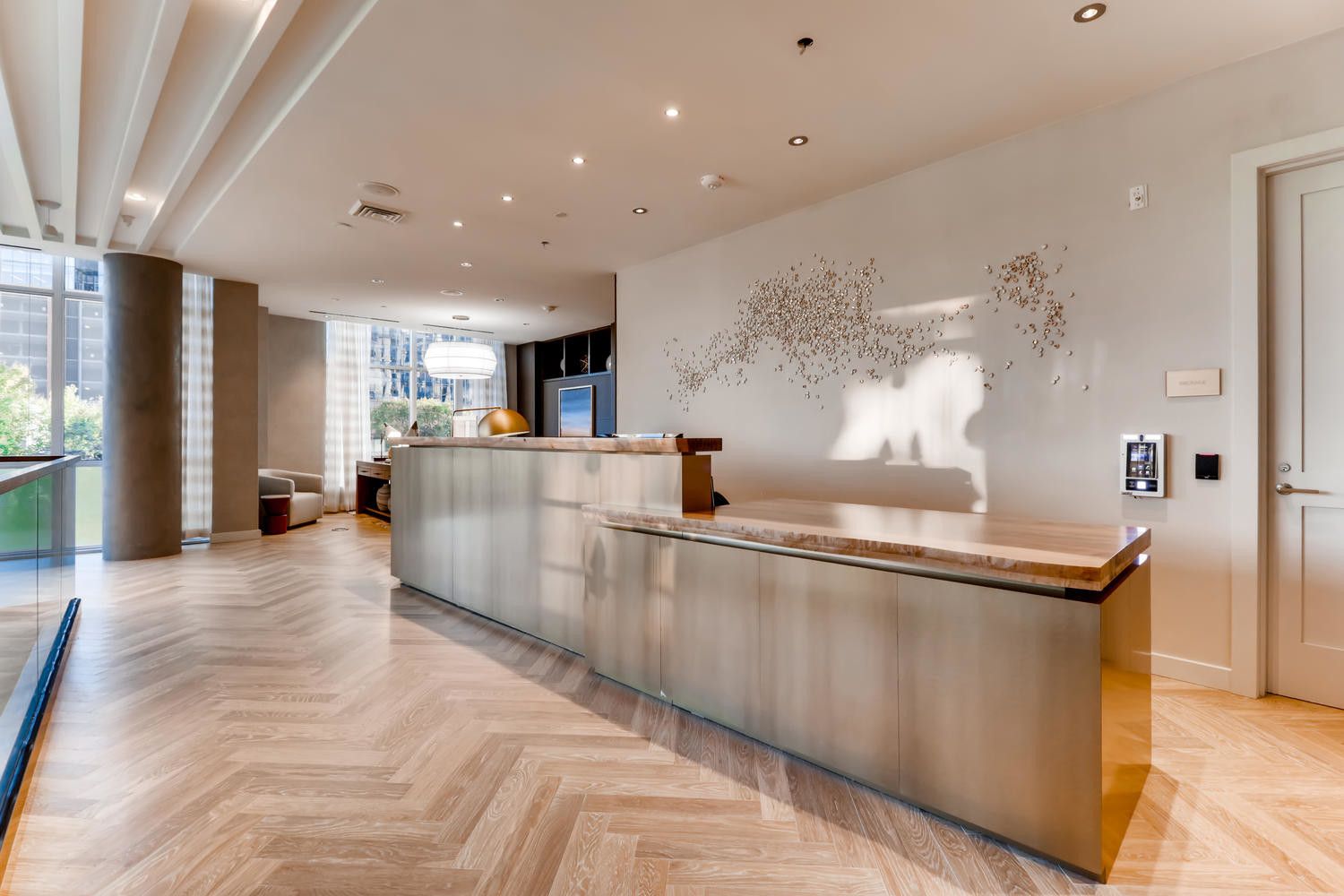 Modern lobby with sleek reception desk and contemporary decor.
