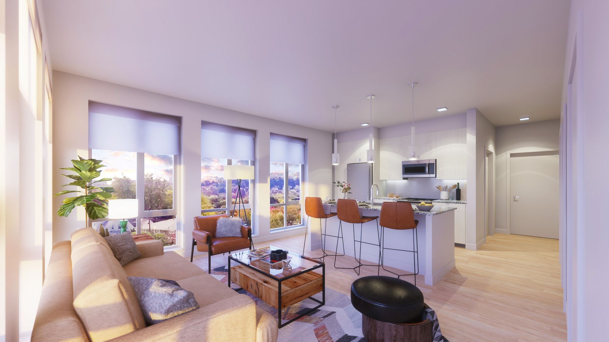 A modern kitchen with a seating area, large windows, and light wood accents.
