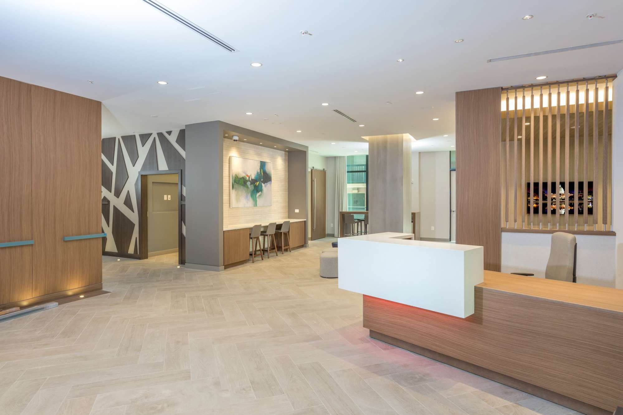 Modern reception area with wood accents and minimalist decor.