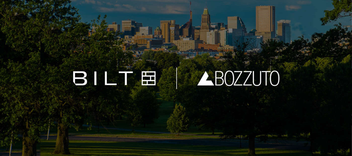 Urban skyline with logos of Bilt and Bozzuto in the foreground.