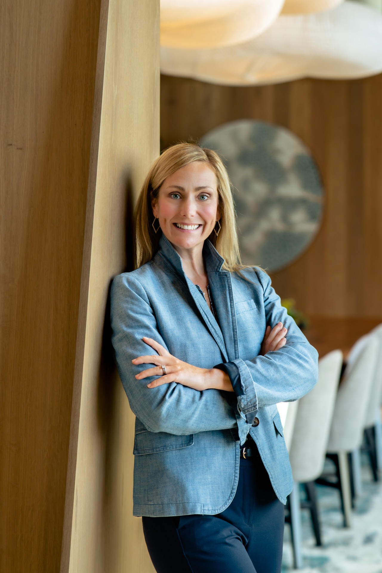 A professional woman in a blazer poses confidently, representing Chintimini M. Keith.