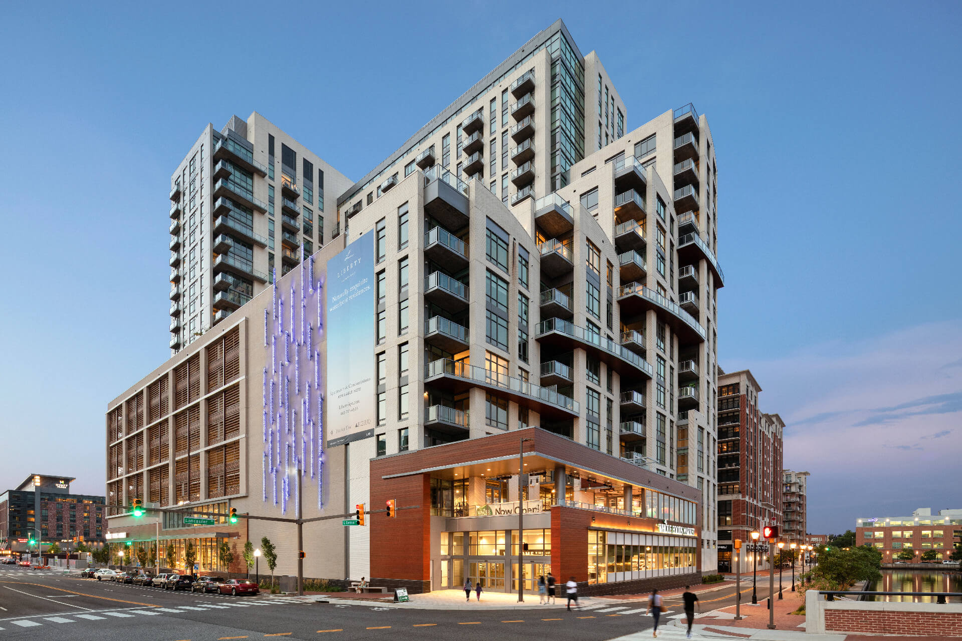 Modern multi-story building with a vibrant exterior and urban setting.