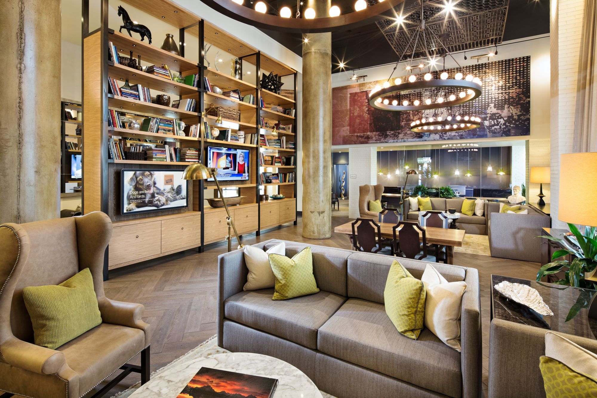 Stylish modern lounge with cozy seating and decorative shelving.