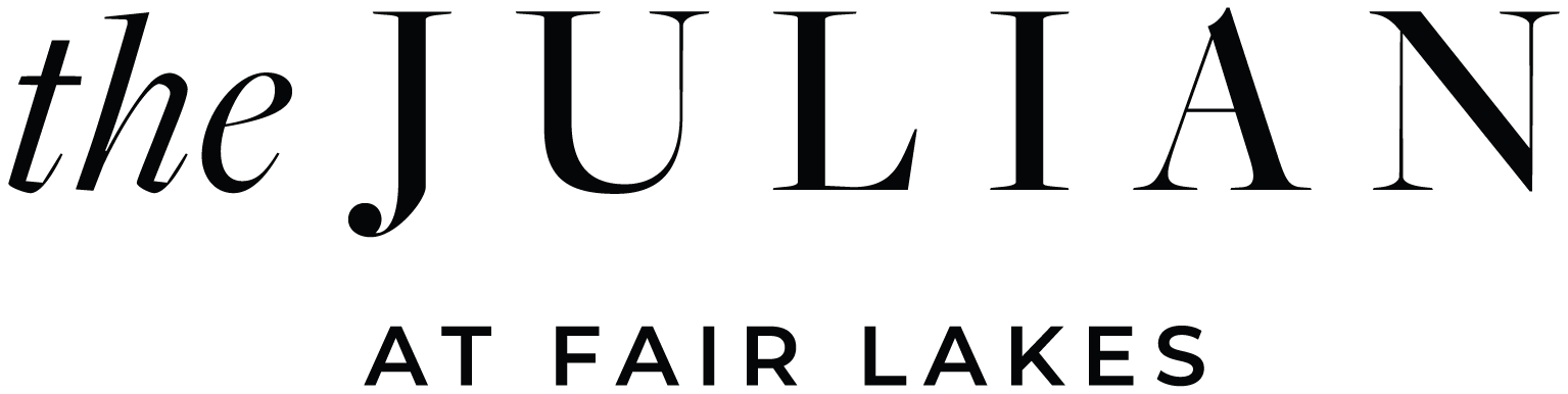 Logo of The Julian, a stylish and modern design featuring elegant typography.
