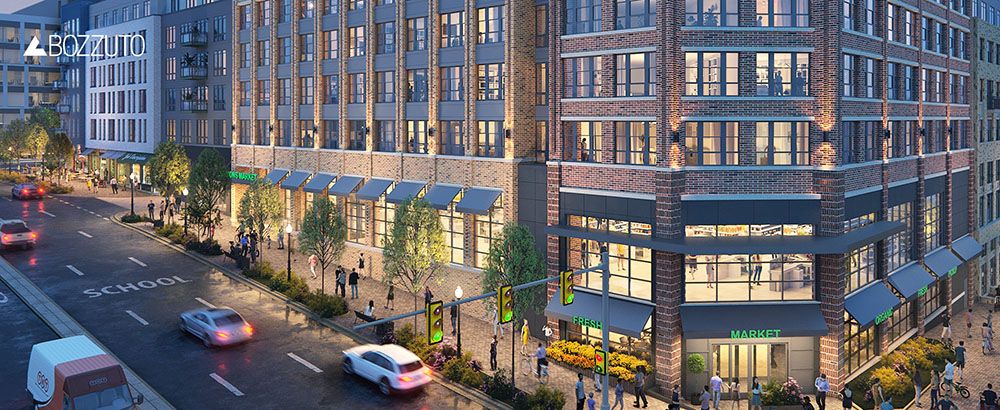 Urban scene featuring a modern building with shops and traffic on a busy street.