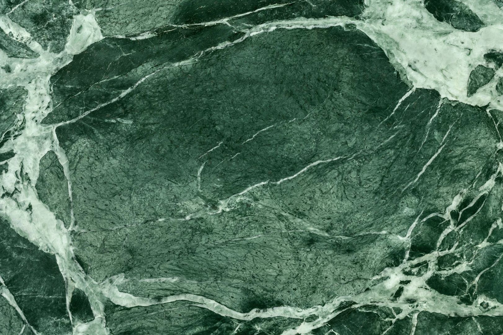 Green marble texture with white veining.