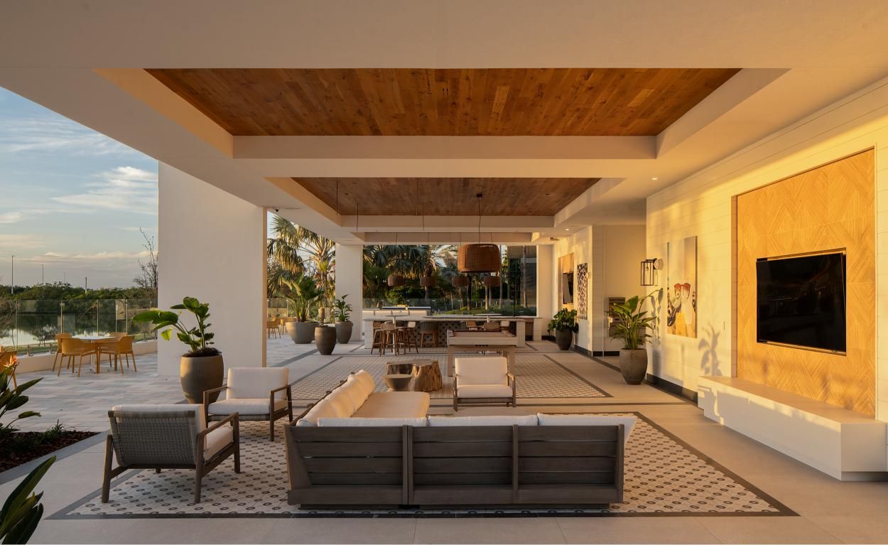 Modern open-concept living space with comfortable seating and large windows.