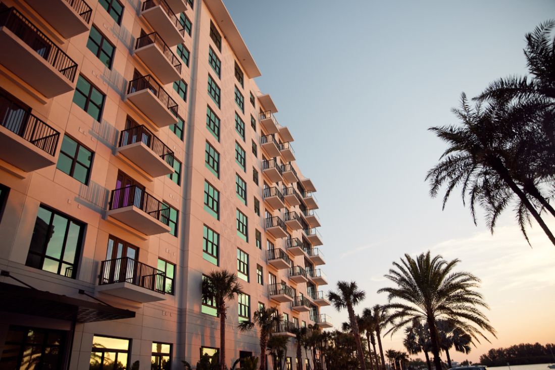 Sunset reflection on exterior building of NOVEL Beach Park