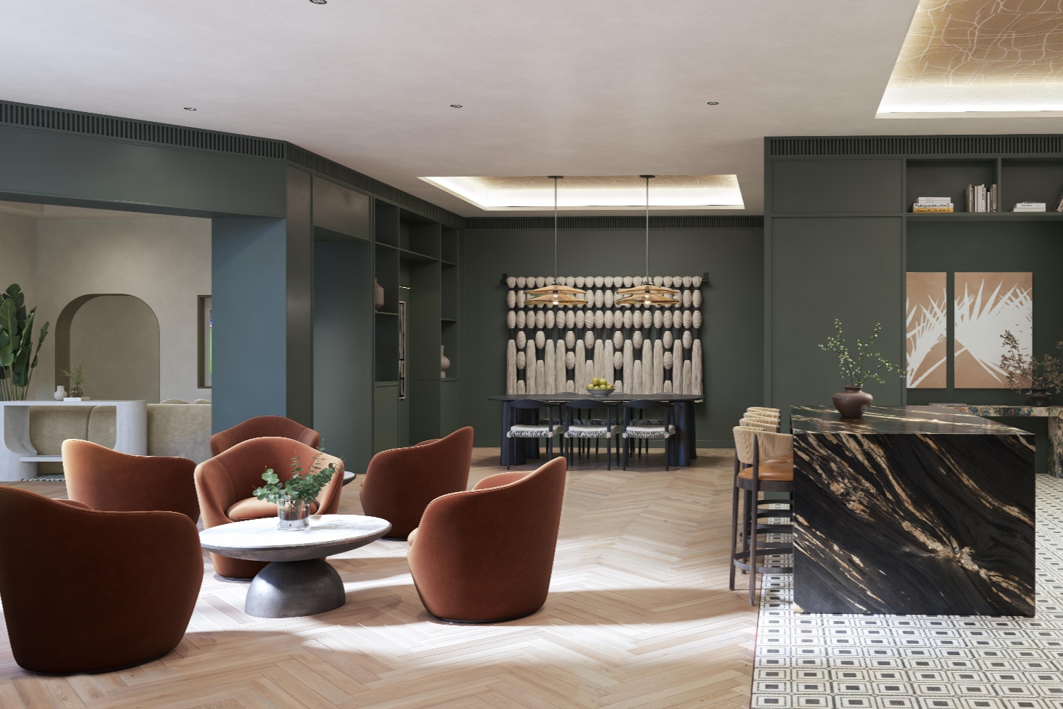 Modern lounge with orange chairs, marble table, and dark walls.