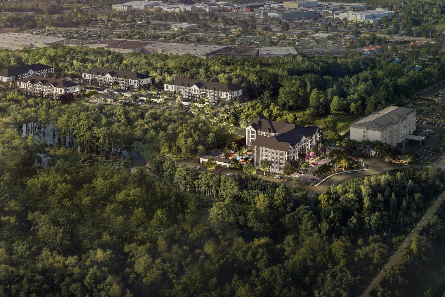 Aerial view of a building surrounded by greenery and residential areas.