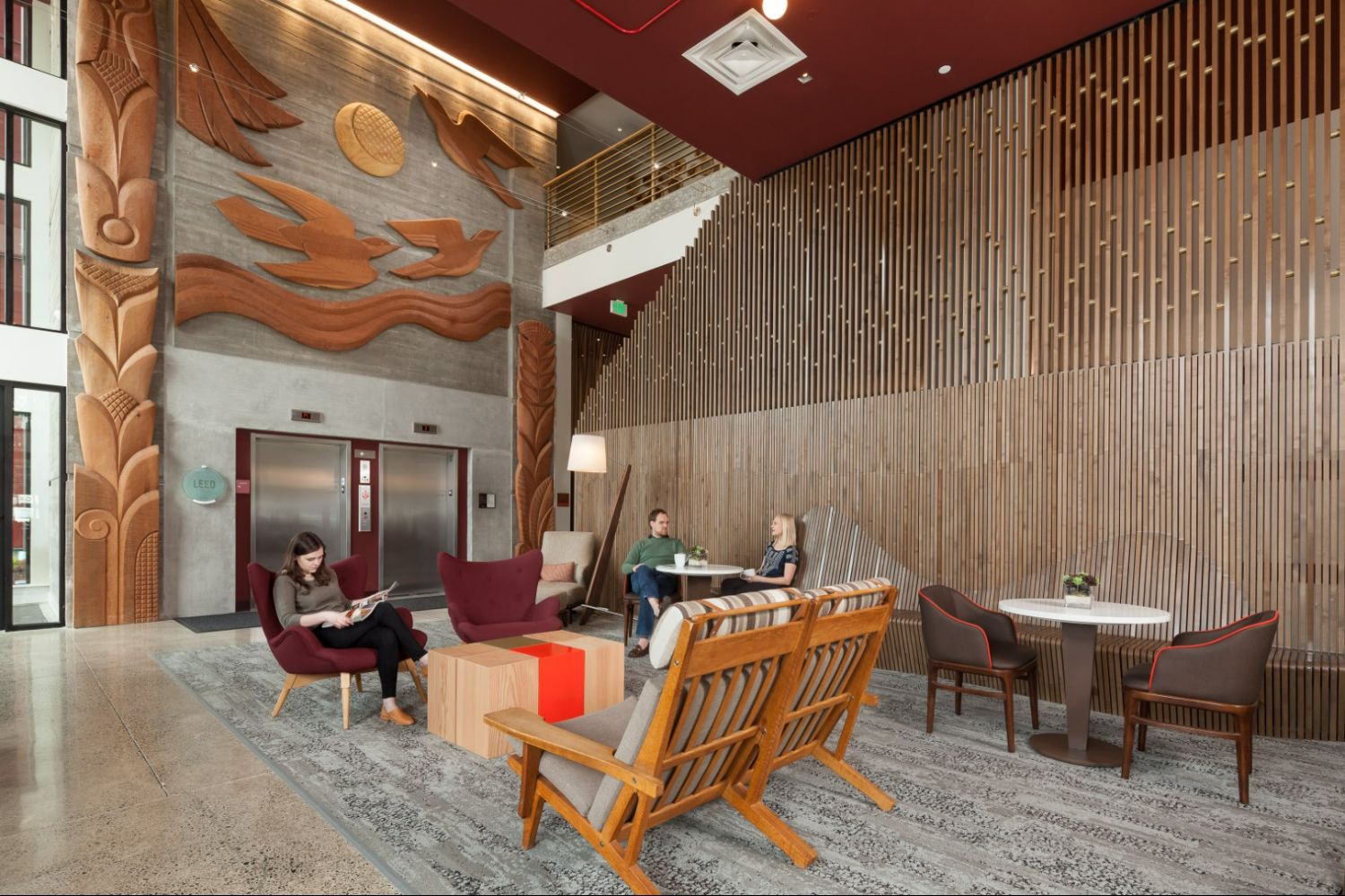 Lobby area of The Carter on the Park Apartments with seating and artwork.
