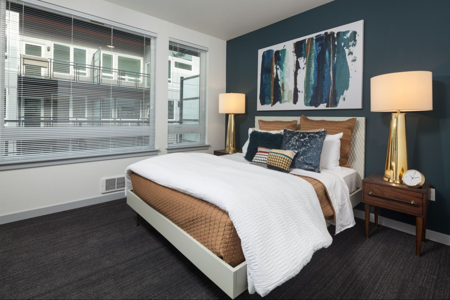 Cozy bedroom in Heron Flats and Lofts featuring modern decor and natural light.