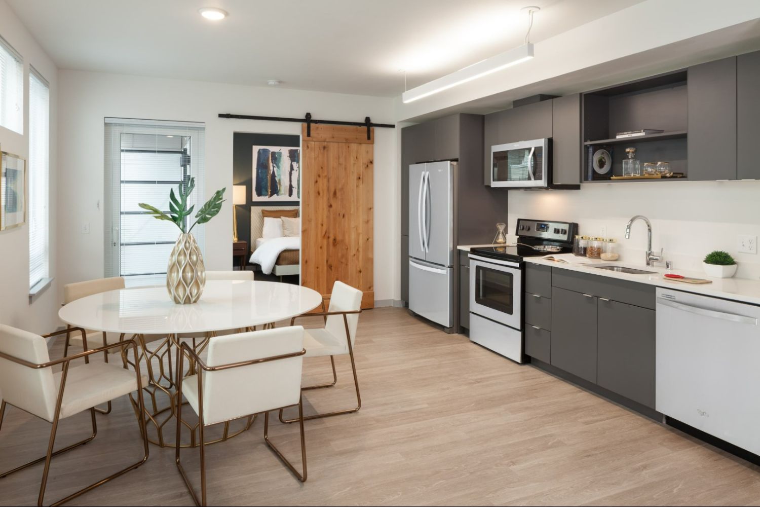 Modern kitchen and dining area at Heron Flats and Lofts.