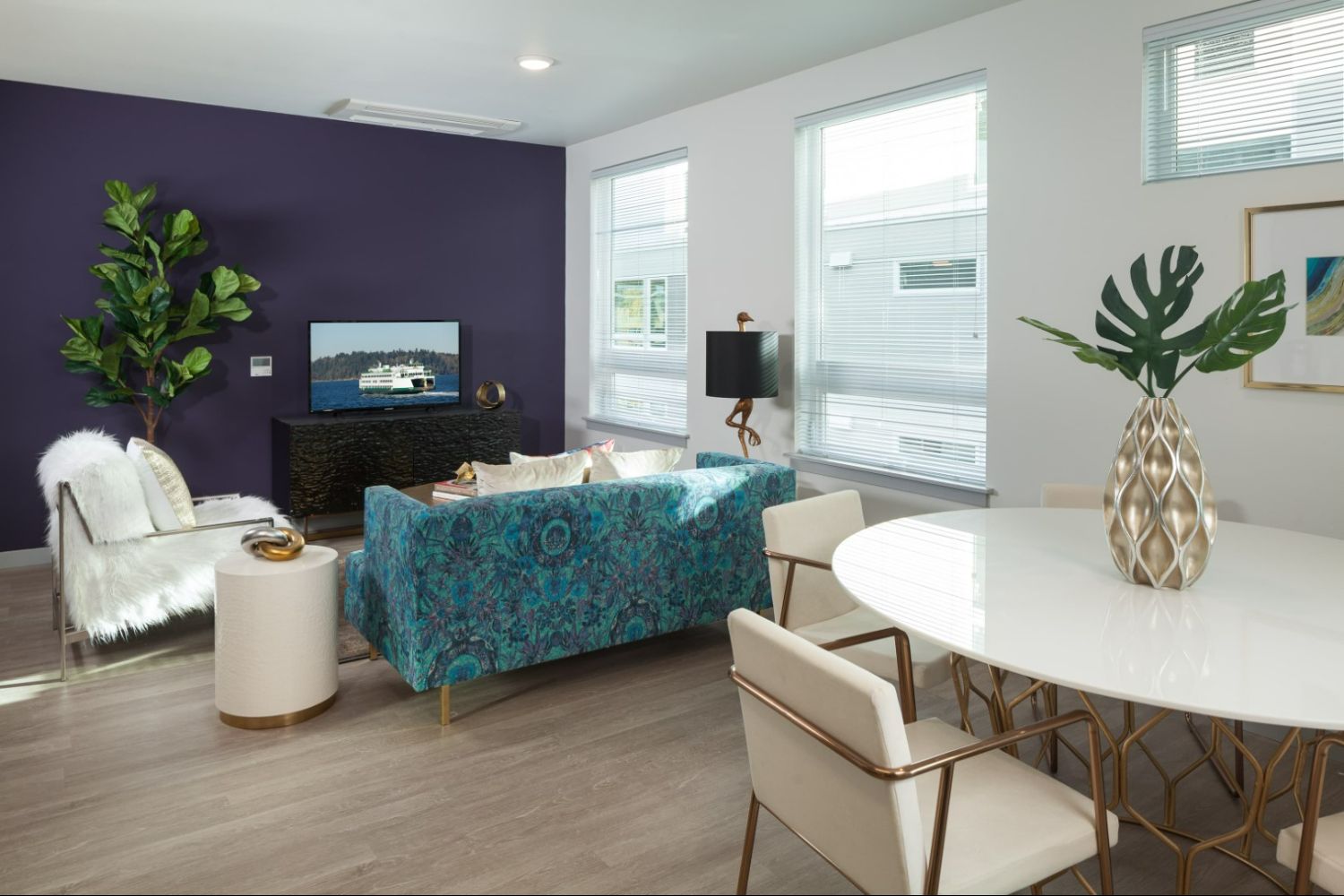 Modern living space at Heron Flats and Lofts with colorful decor and large widows.