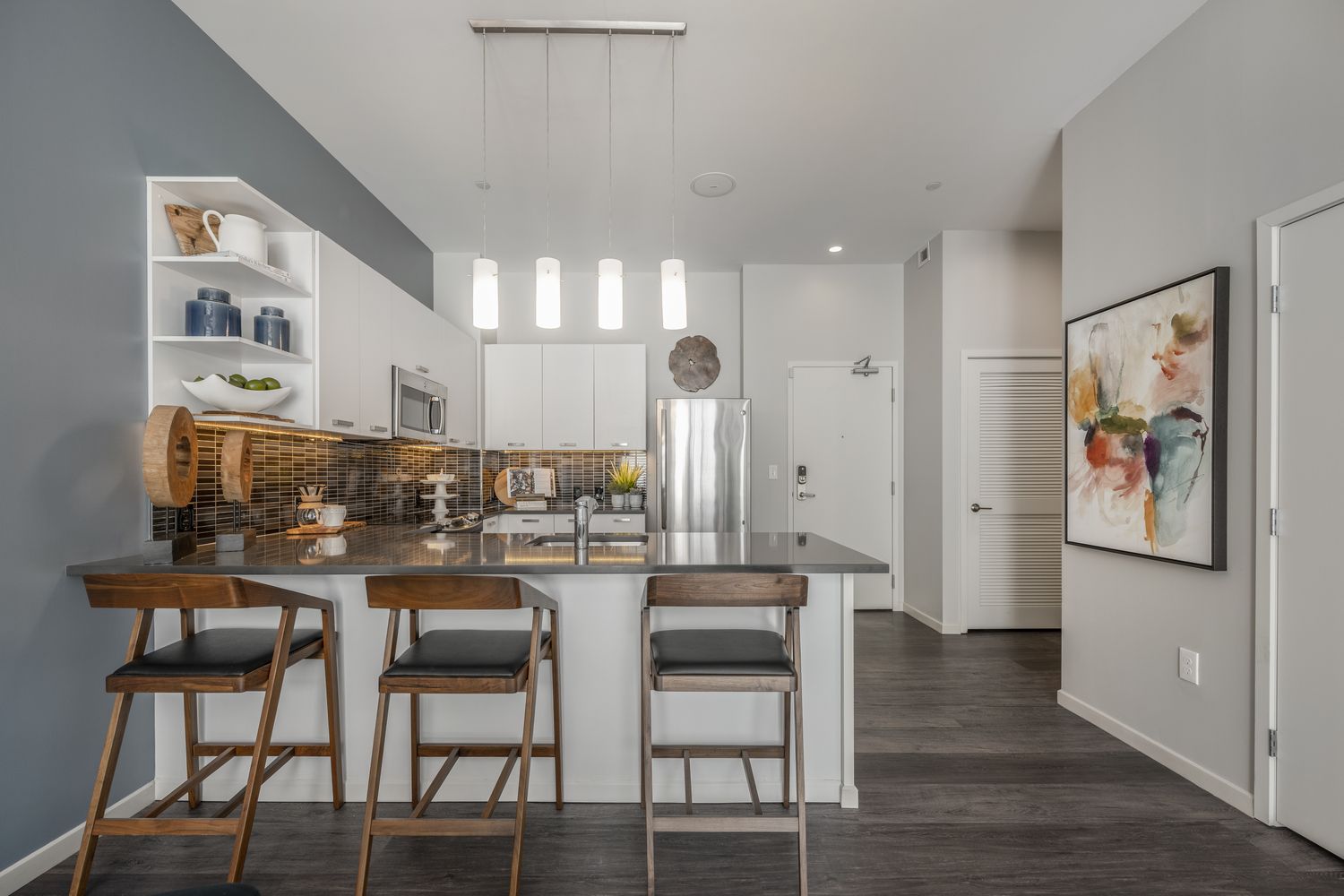 Kitchen and front door view in apartments.
