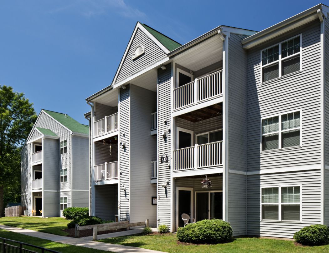 Exterior view of Silverwood Farm apartments and professionally landscaped grounds.