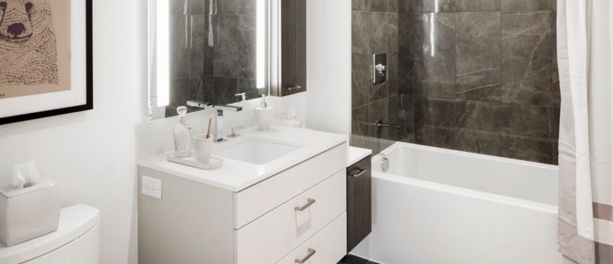 Inspired by preeminent resorts, our bathroom's feature oversized soaking tubs, lighted mirrors, and multi-level vanities for generous storage.