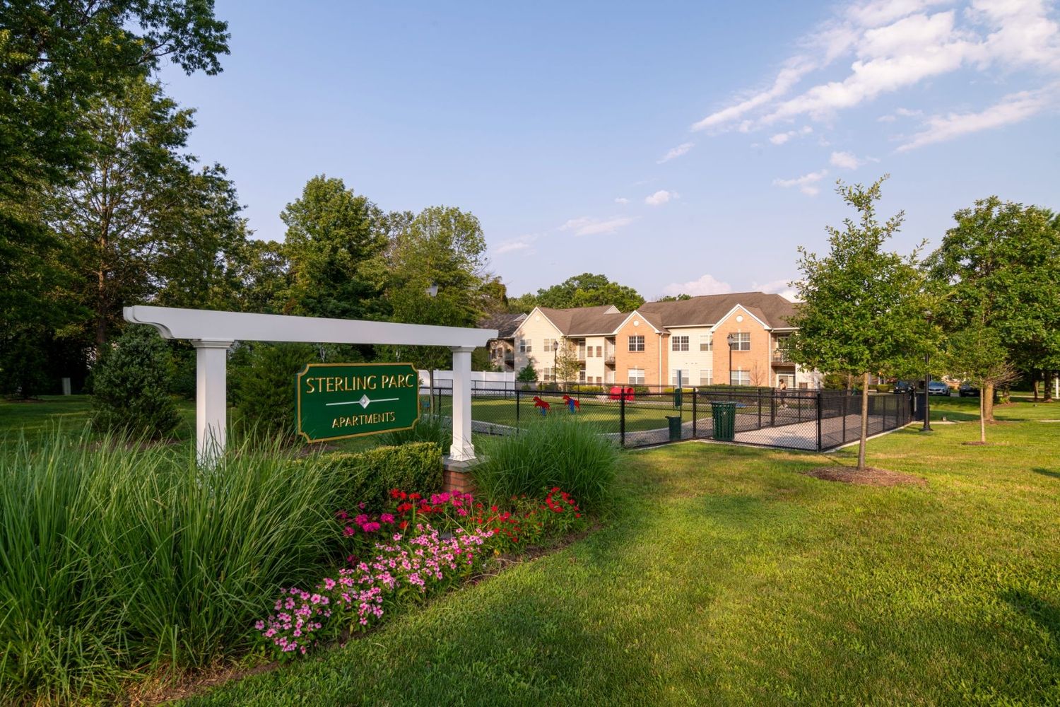 View of apartment building and sign
