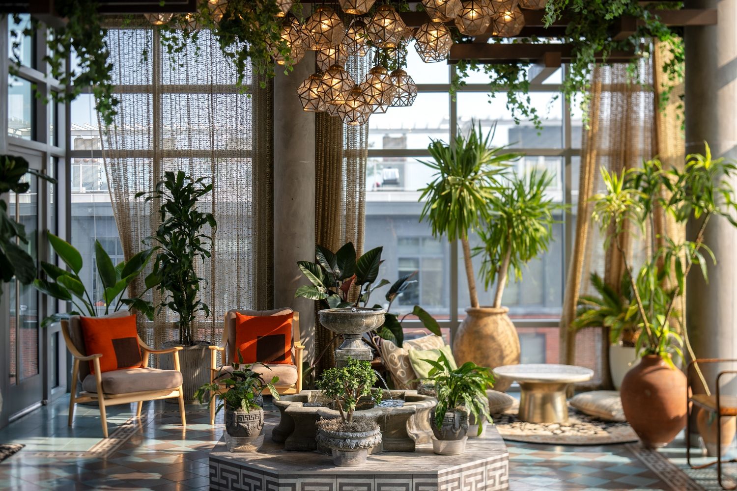 Experience the serenity of our conservatory's lush greenery and cozy seating areas.