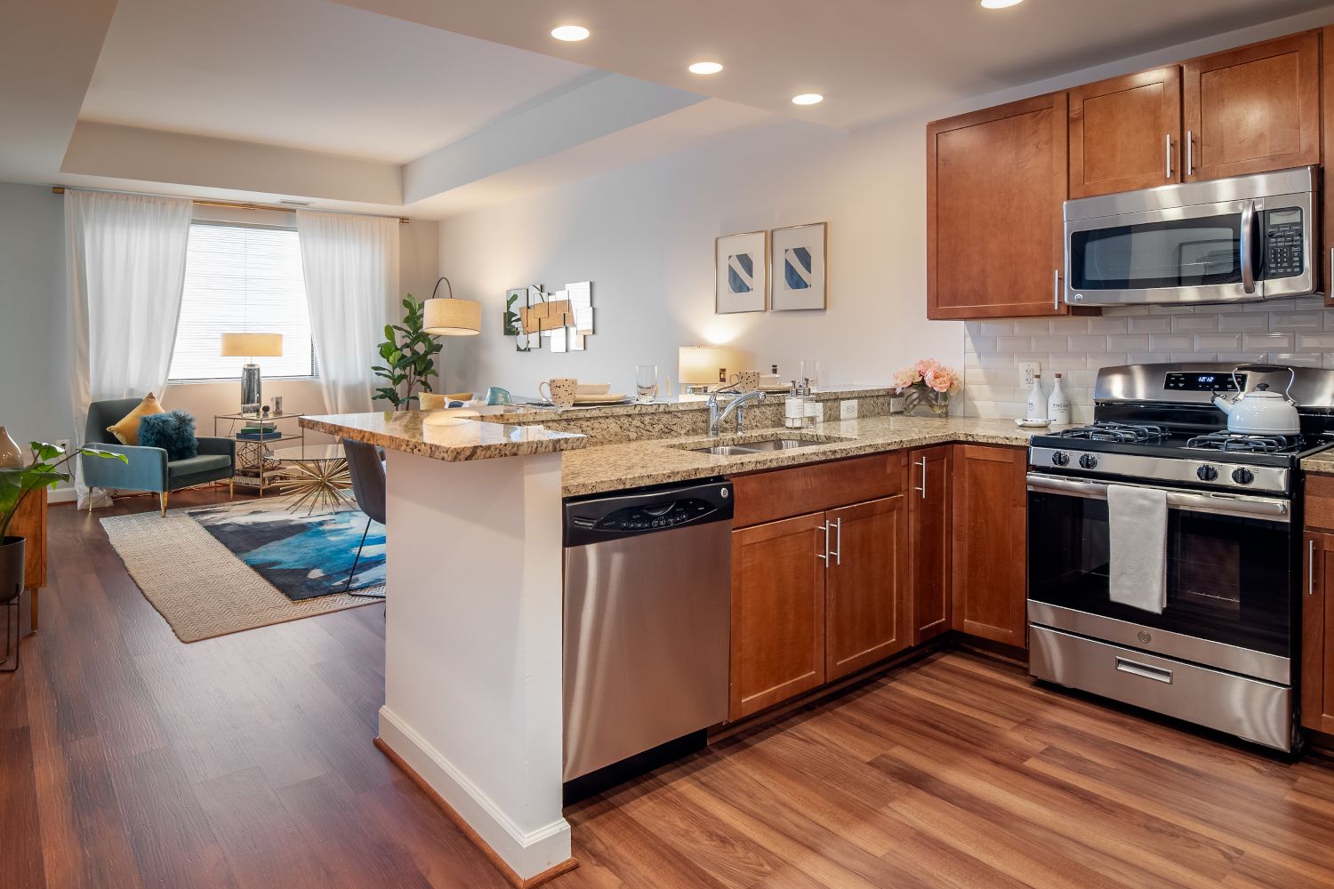 Gourmet kitchens with stainless steel appliances, granite countertops, and cherry wood cabinets.