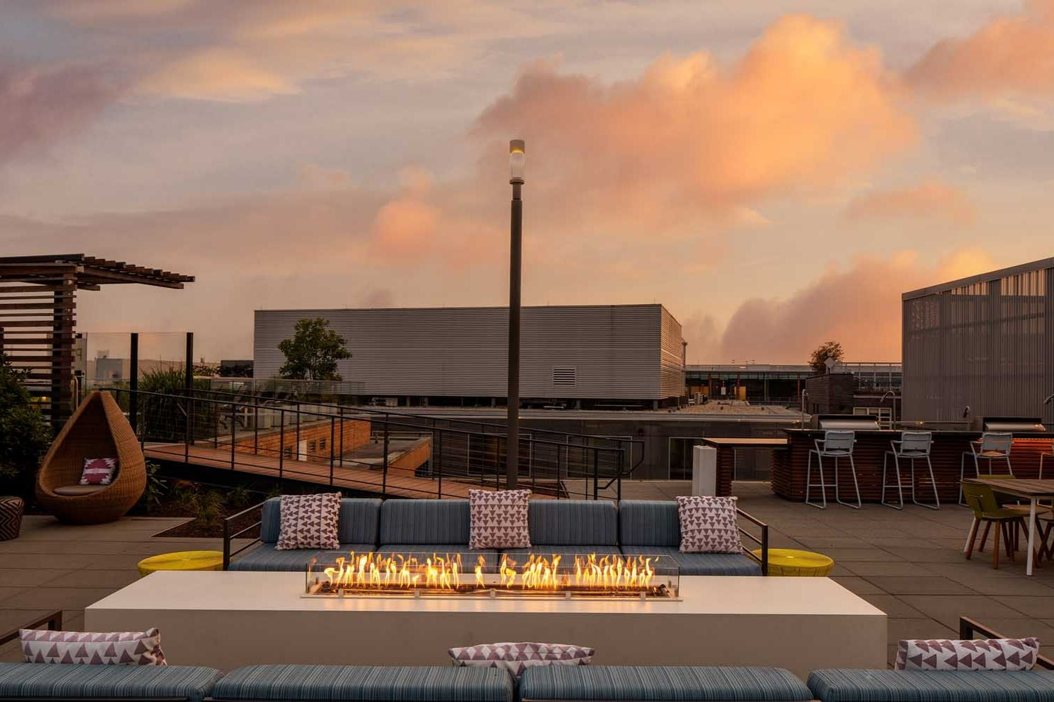 Gather and mingle around the rooftop fireplace