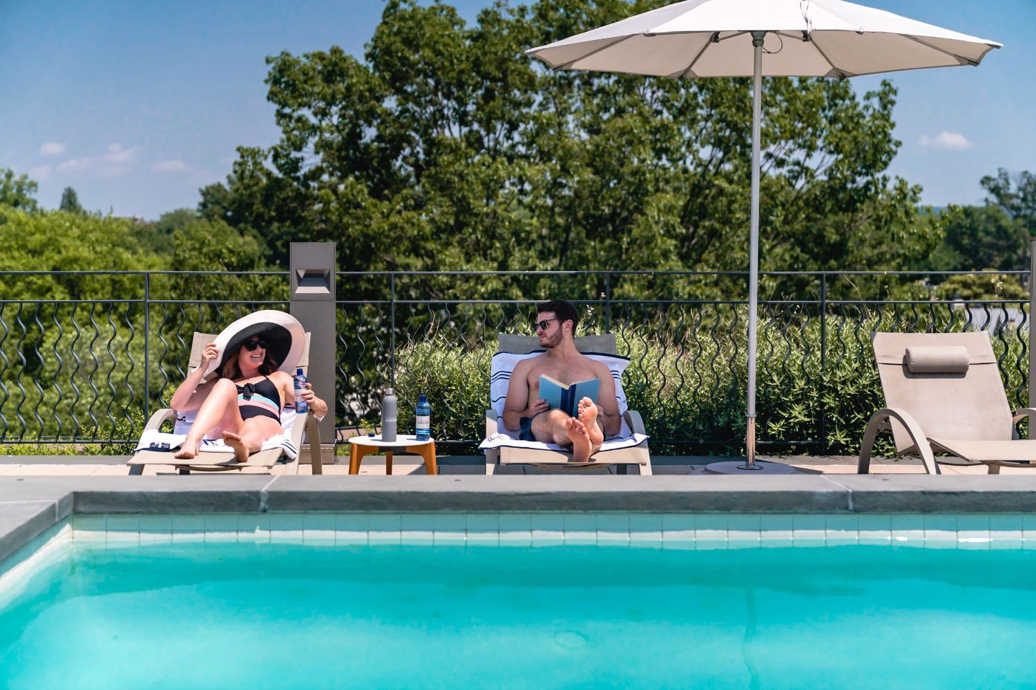 Stay cool by the pool beneath our outdoor patio umbrellas.