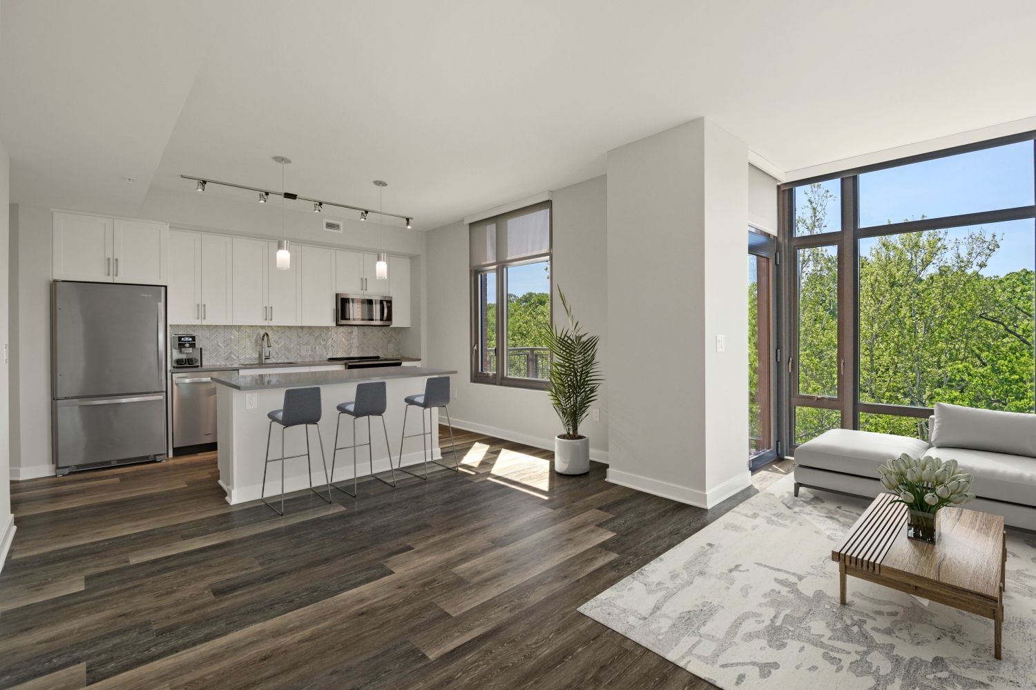 Luxe, wide-plank flooring in kitchens and living areas