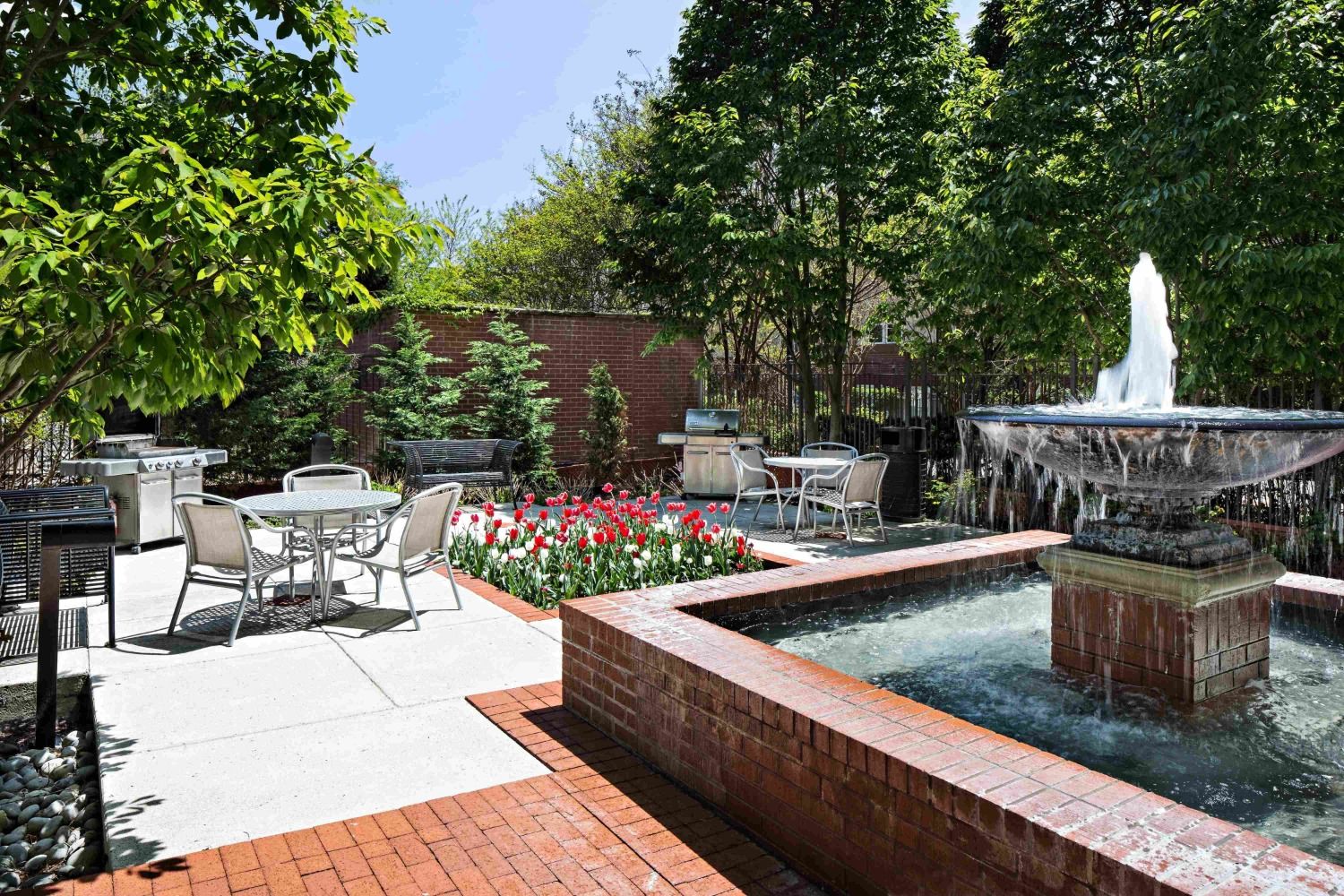 Escape to a private courtyard with grills and fountain