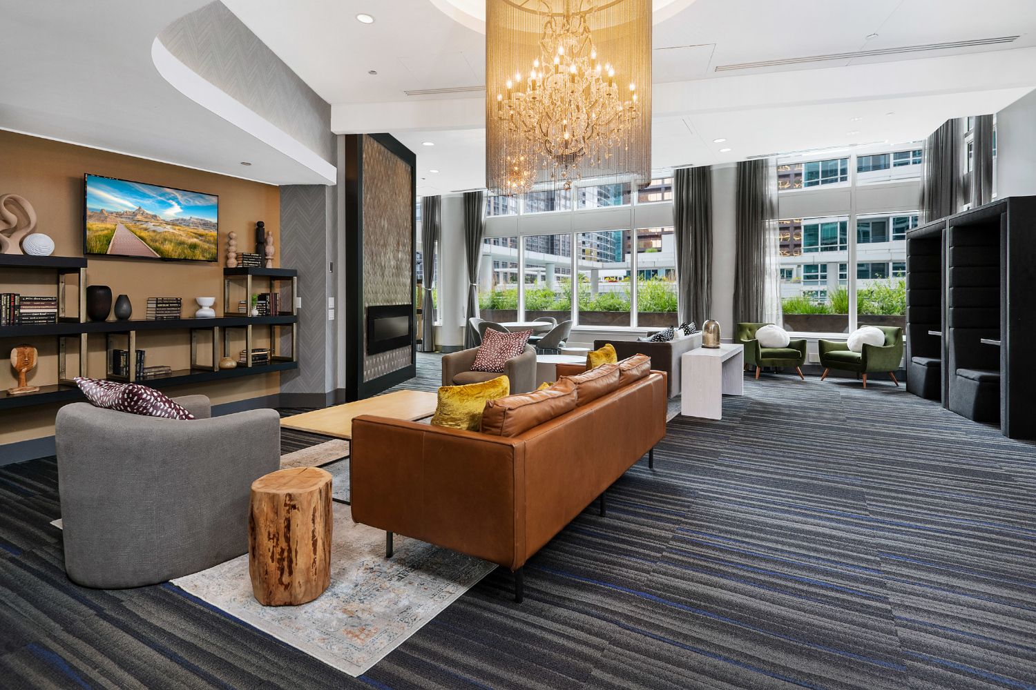 Wide angle of the resident lounge decorated with comfortable couches and table sets.