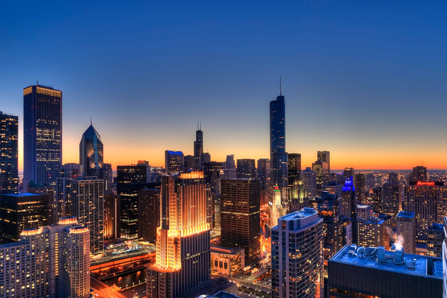 Wide sweeping view of the Chicago skyline and city lights from Atwater Apartments.