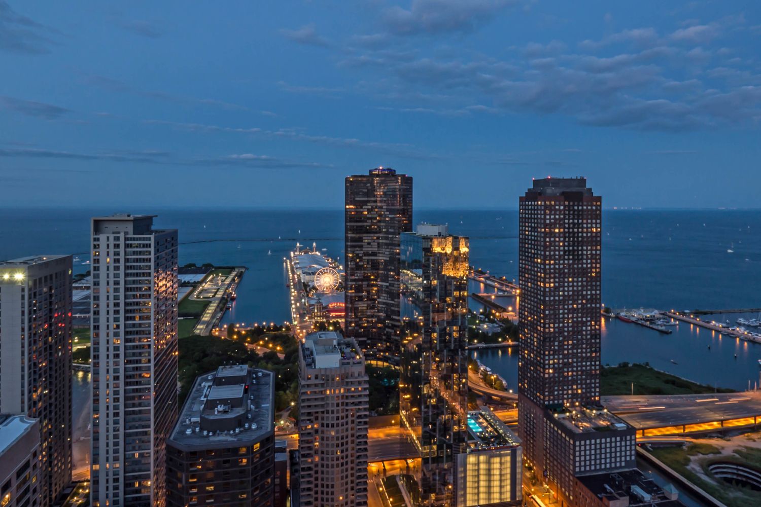 Wide angle of Atwater's east views at dusk capturing Navy Pier and Lake Michigan.