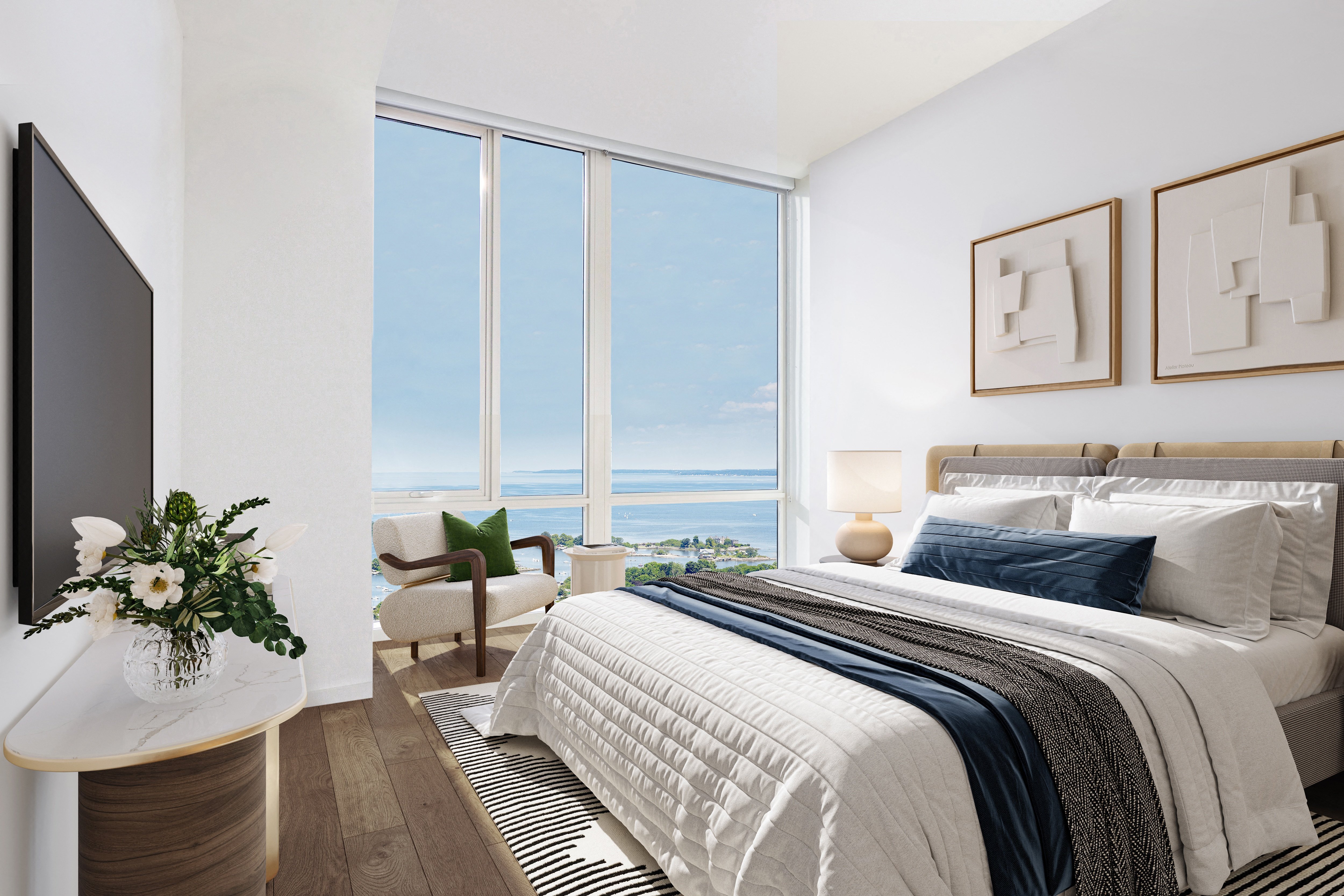 Modern bedroom with large windows, ocean view, and minimalist decor.