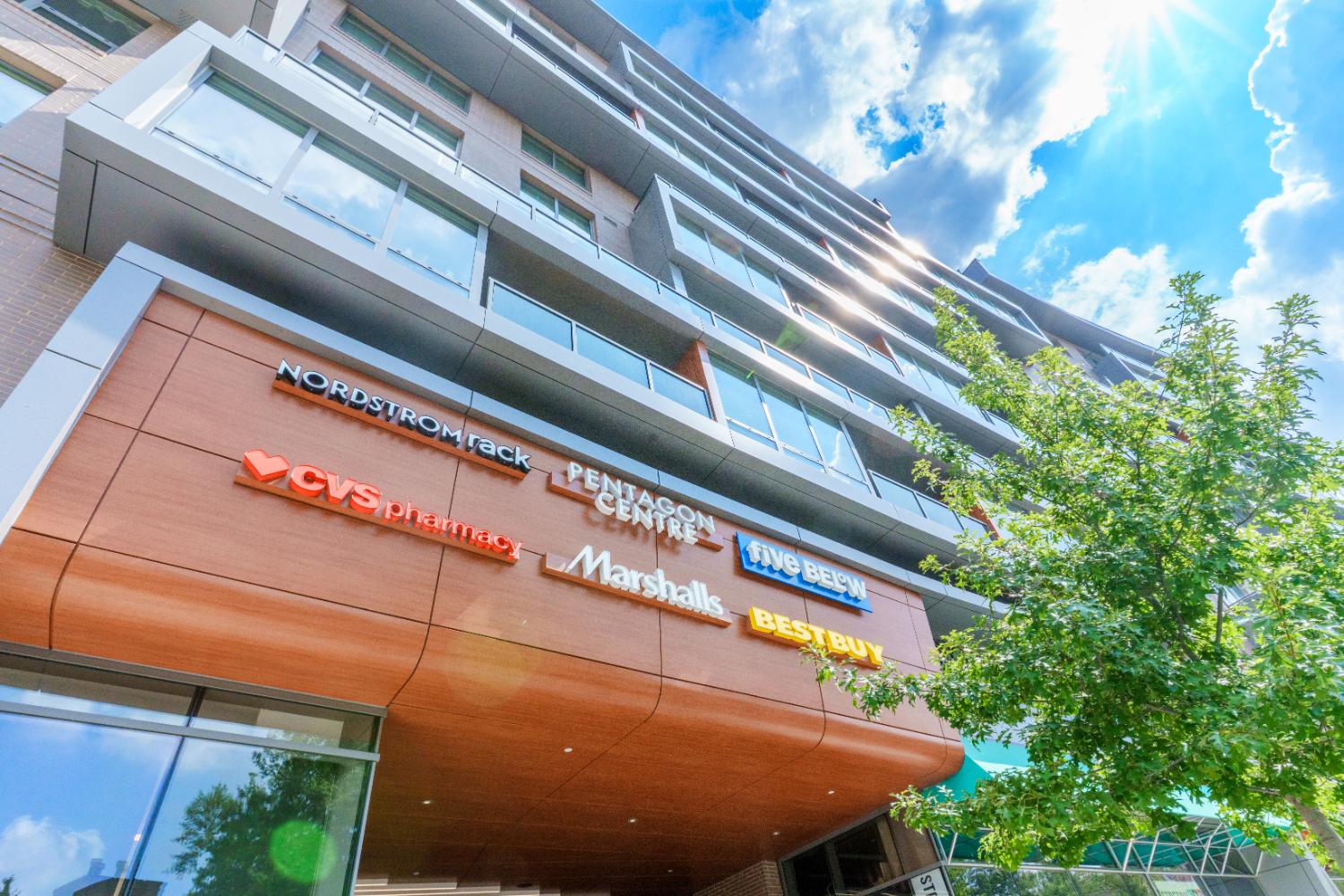 Modern building with colorful signage under a bright sky