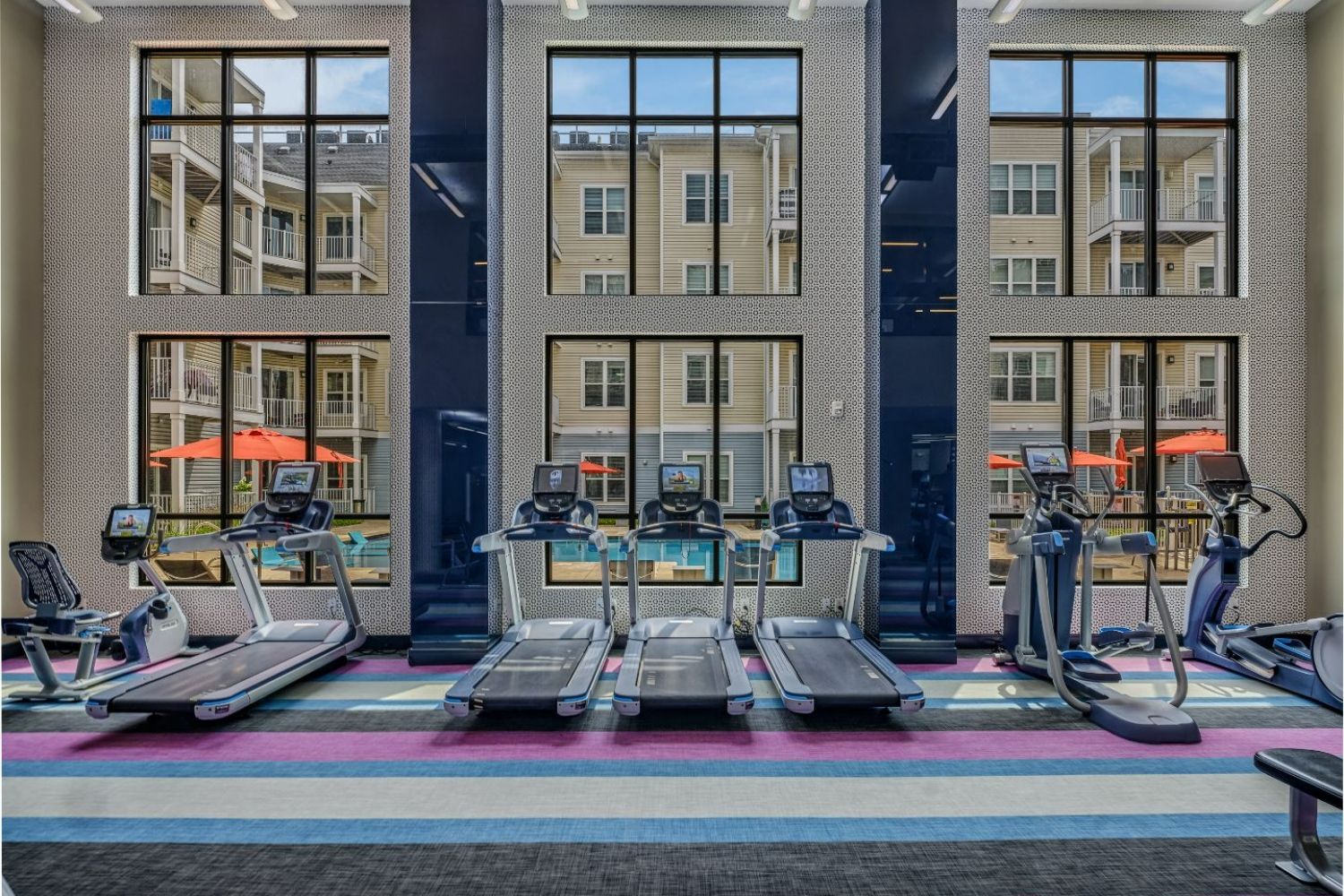 Cardio Equipment with a View of the Pool