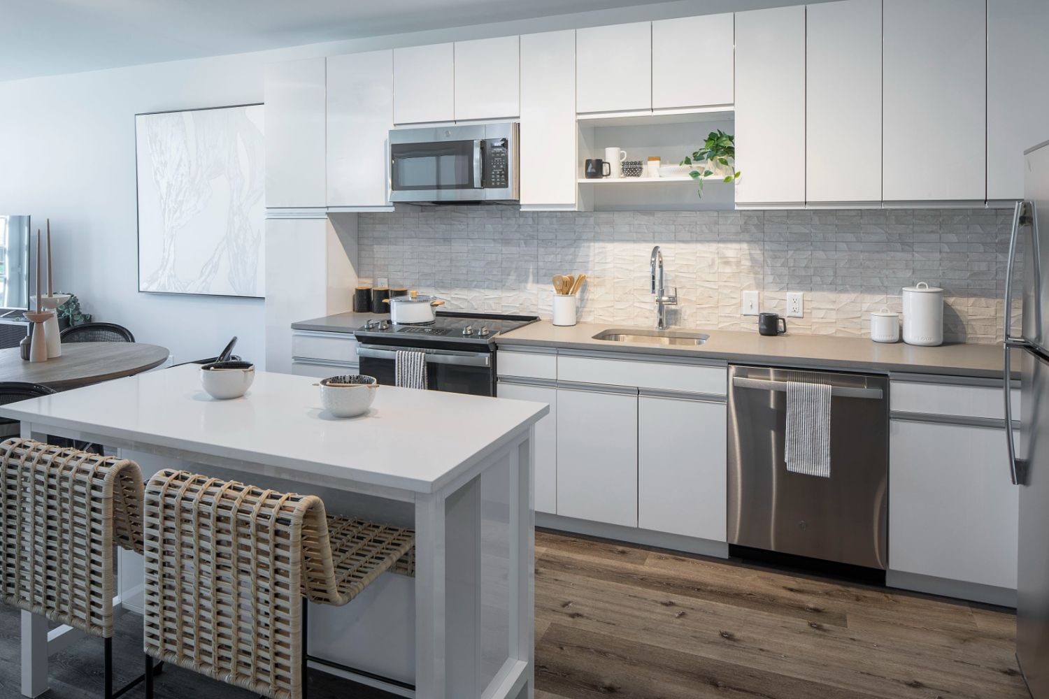 Kitchen with dining island and view of living room