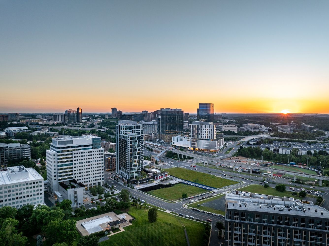 Aerial view of a city skyline at sunset.