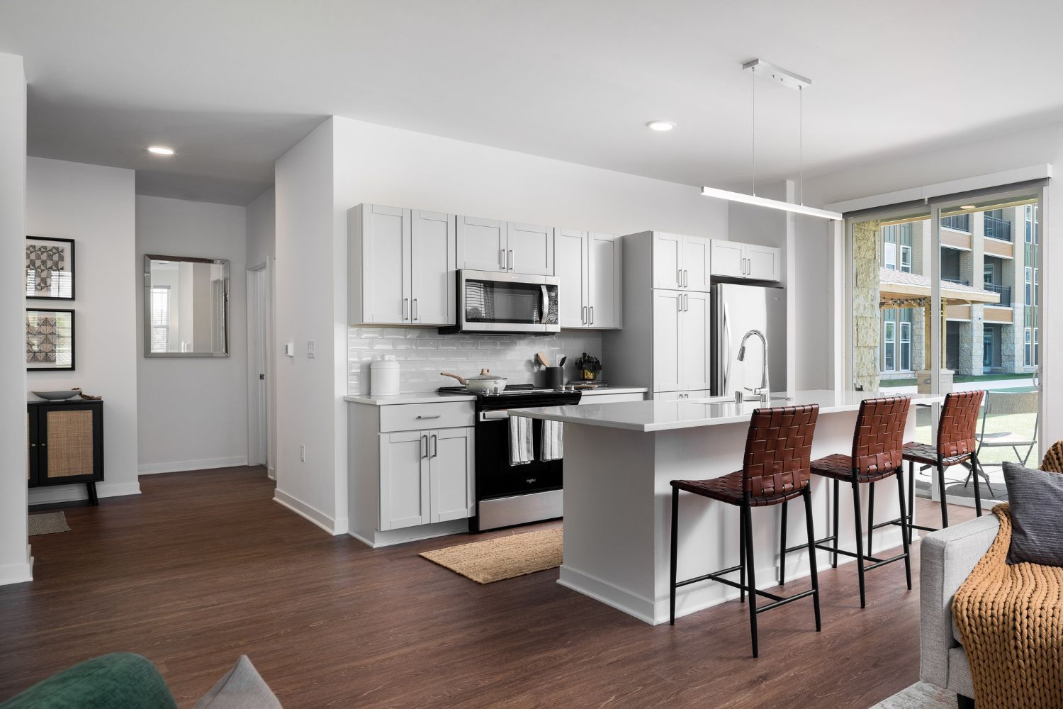 Wood plank floors enhance the apartments' clean, modernist style.