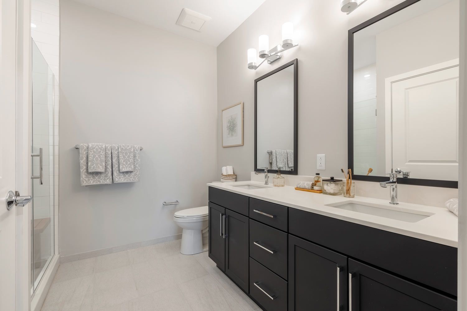 Large bathrooms with dual vanity sinks and walk-in shower