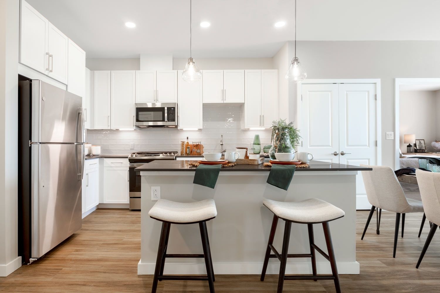 Quartz countertops and large islands with pendant lighting