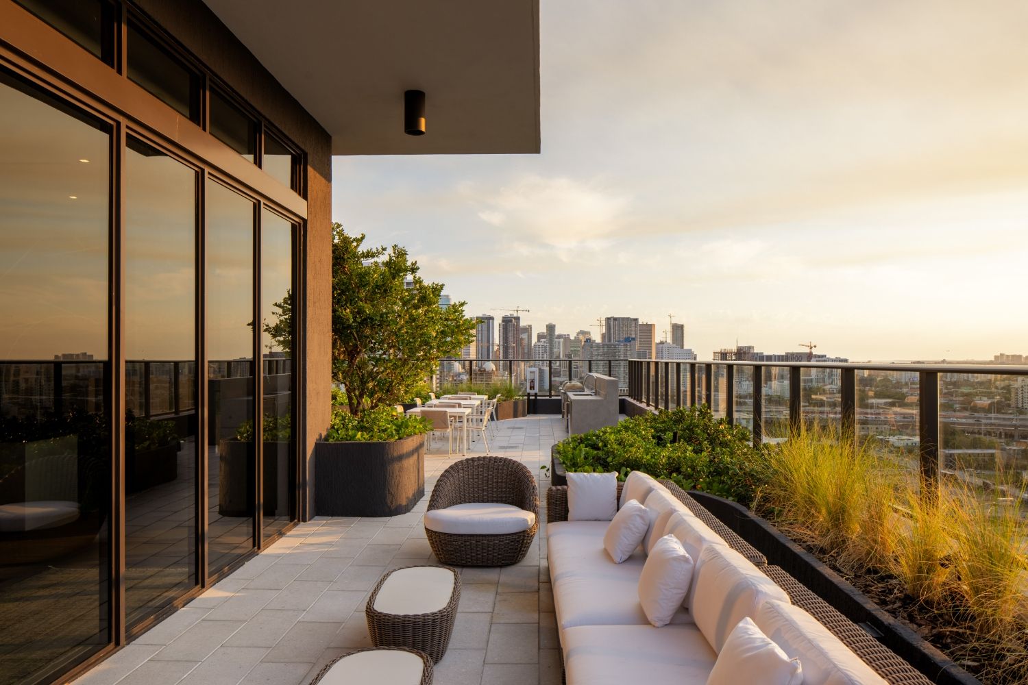 Rooftop lounge and grill area at sunset