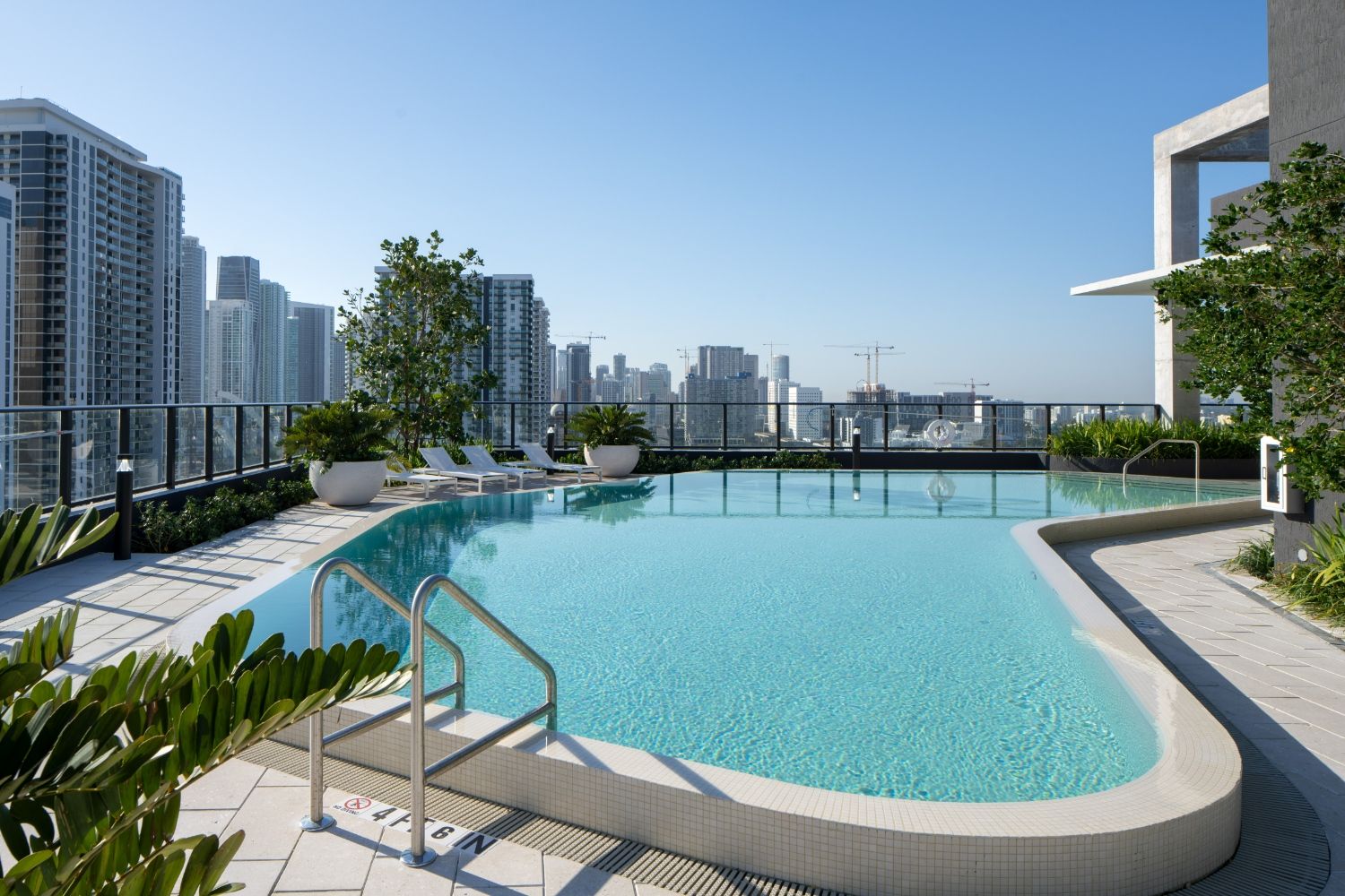 Resort style rooftop pool with views of the Miami skyline