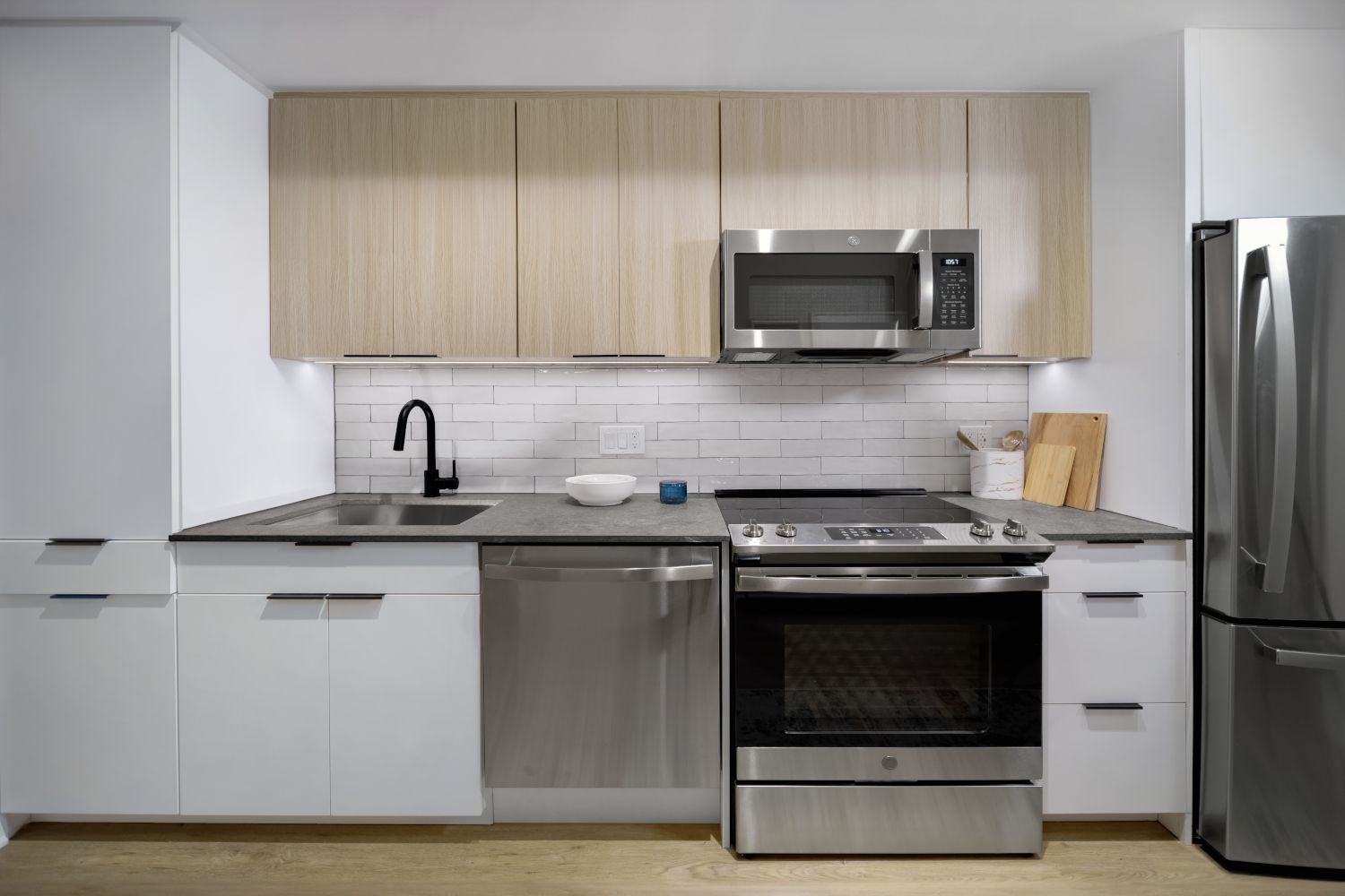Embrace spacious kitchens with quartz countertops and stainless steel appliances.