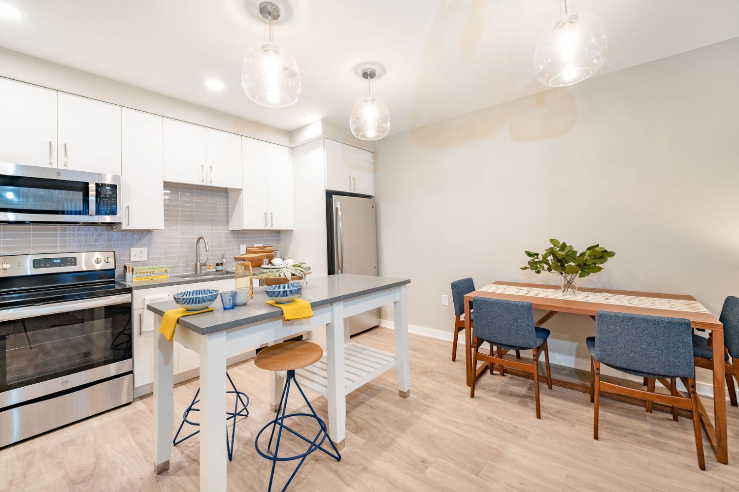 Apartment kitchen with island and dining table