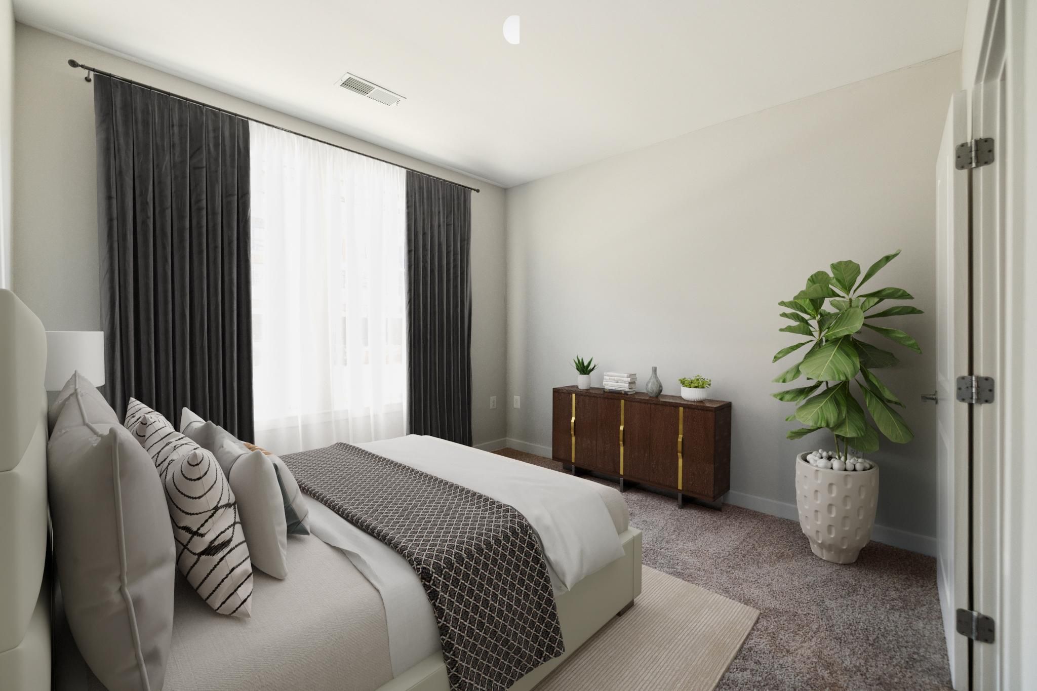 Modern bedroom with a bed, dark curtains, a plant, and a wooden dresser.
