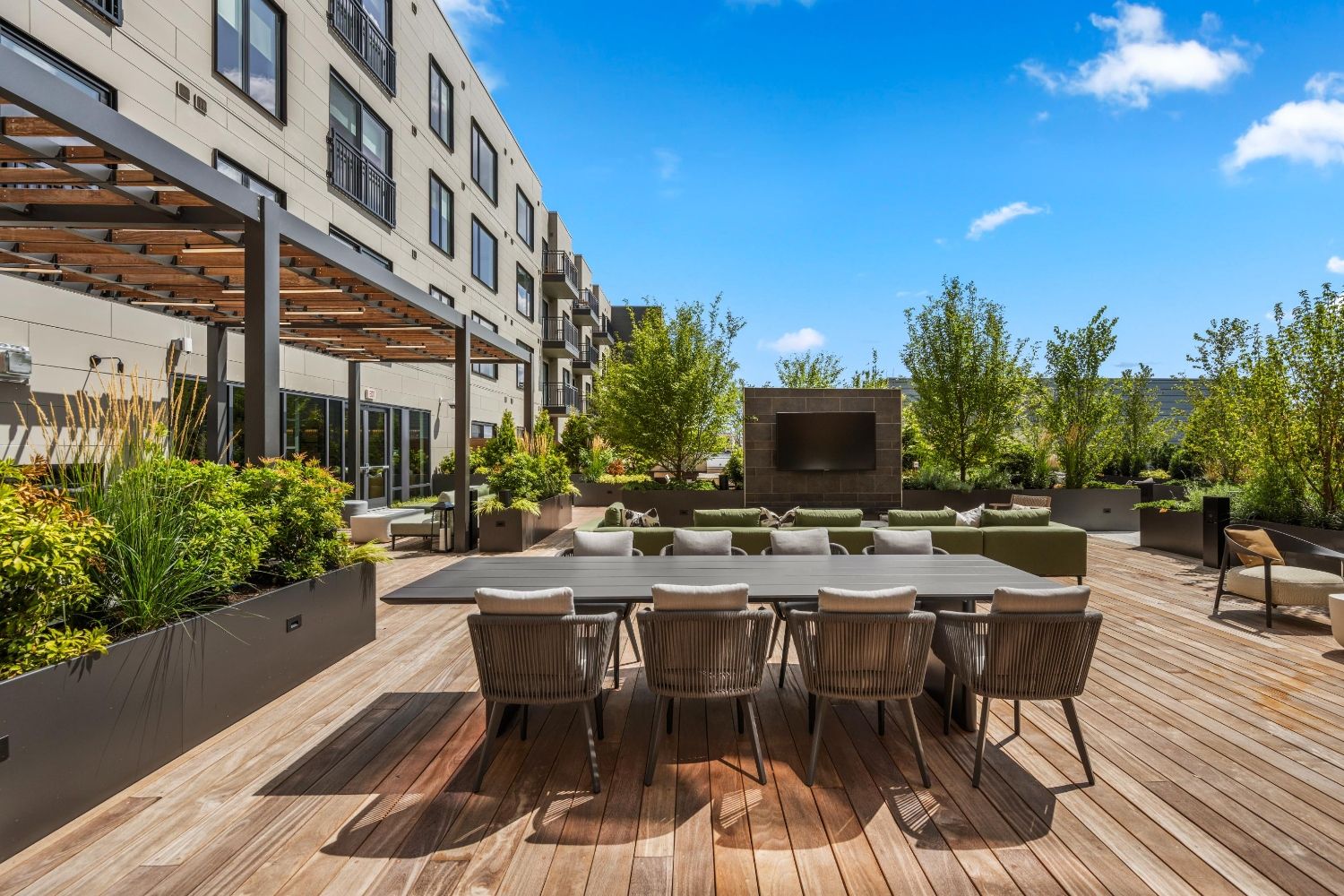 Enjoy friendly competition and socializing at our rooftop deck's bag toss area, complete with communal seating.