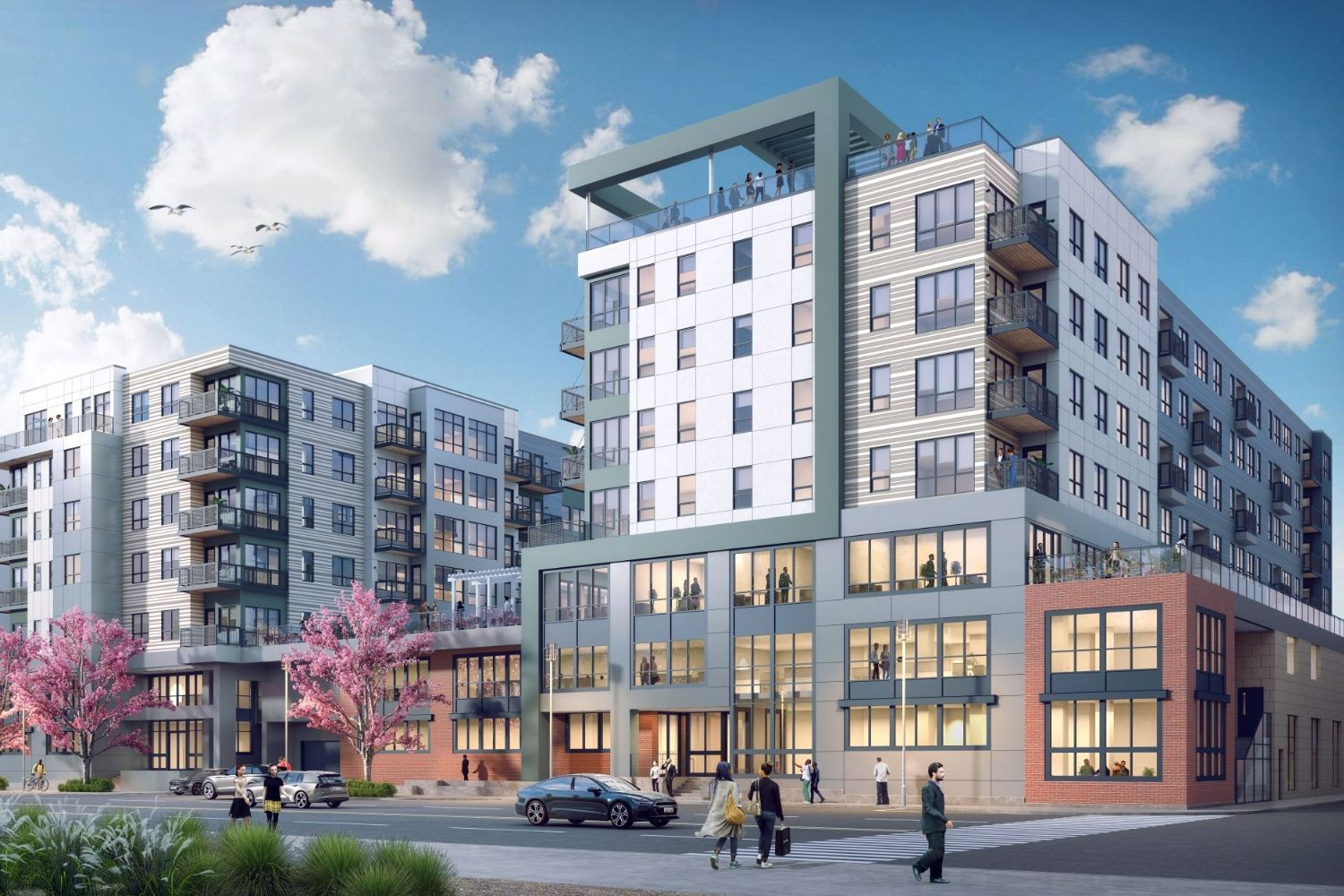Modern apartment buildings with balconies, surrounded by trees and clouds.