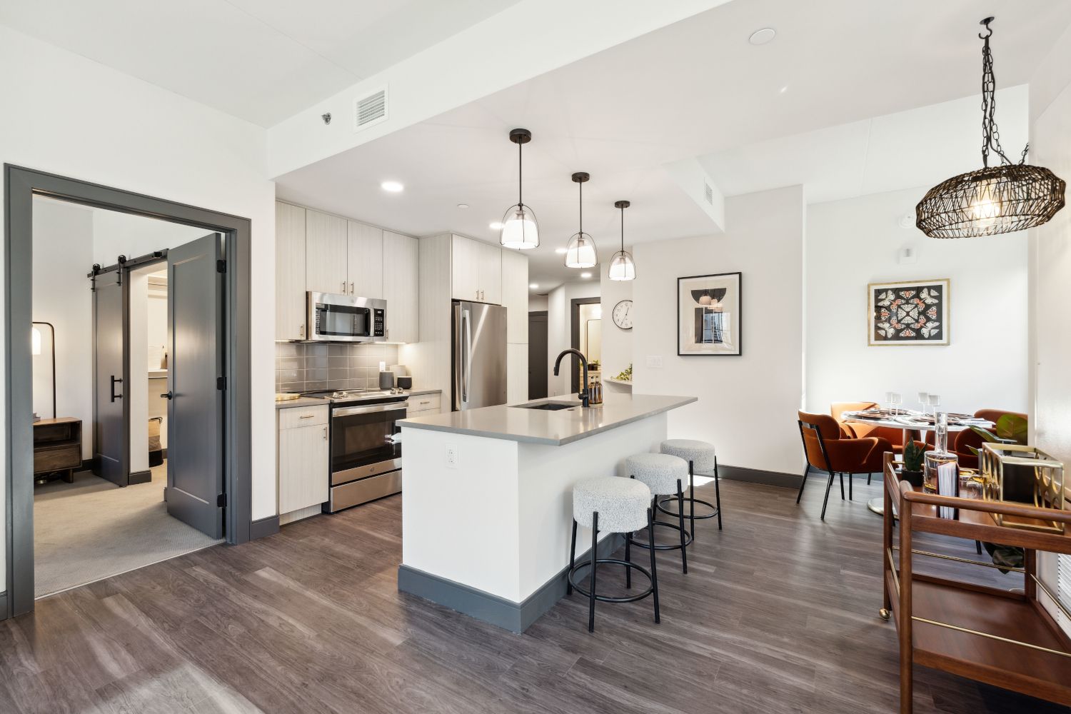 Apartment kitchen and dining showing entry to bedroom