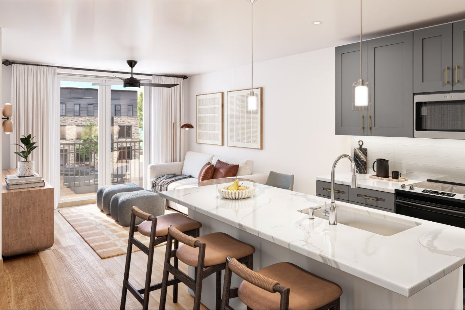 Modern open-plan kitchen and living area with bar seating and natural light.