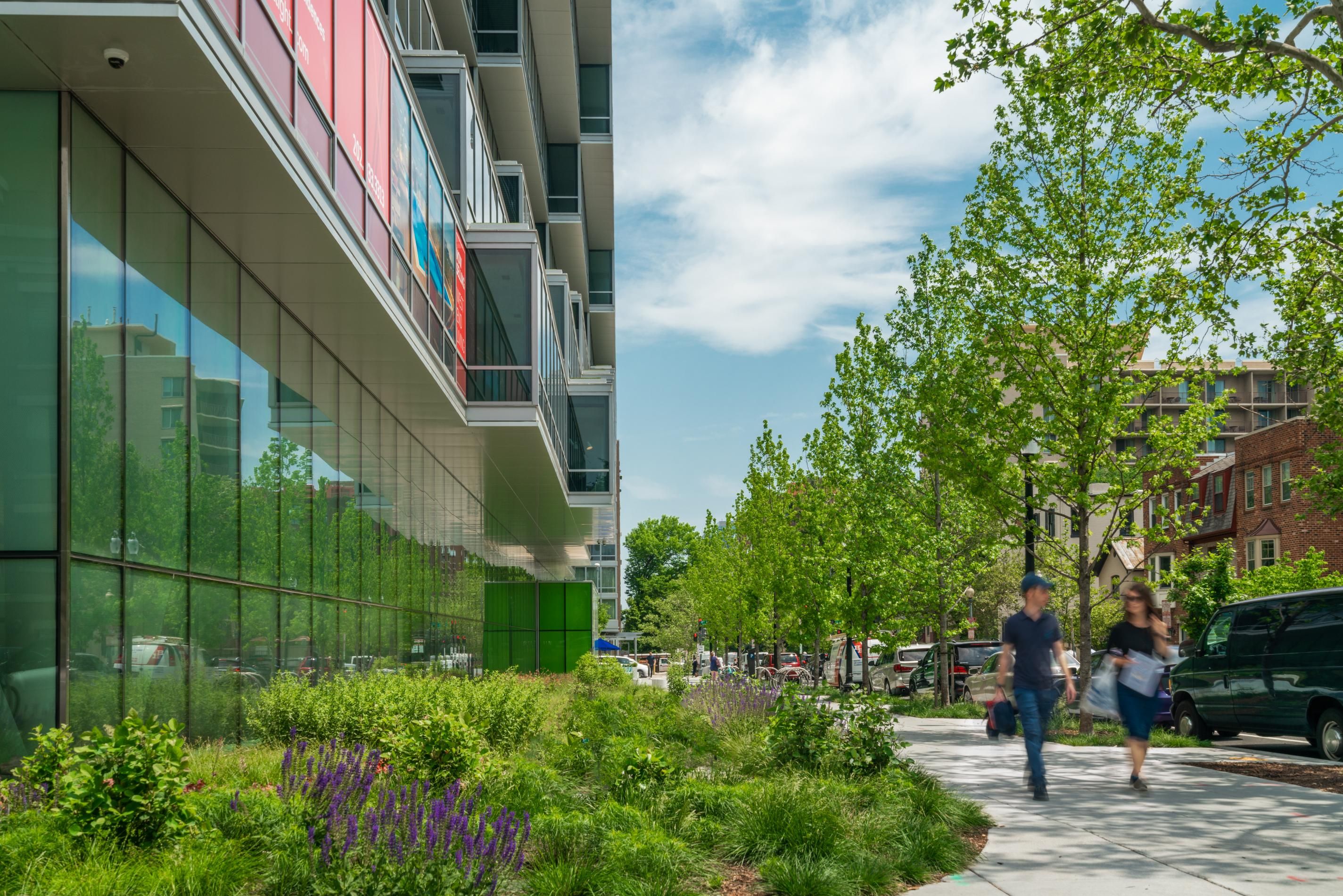 View of ground level exterior with people walking on sidewalk