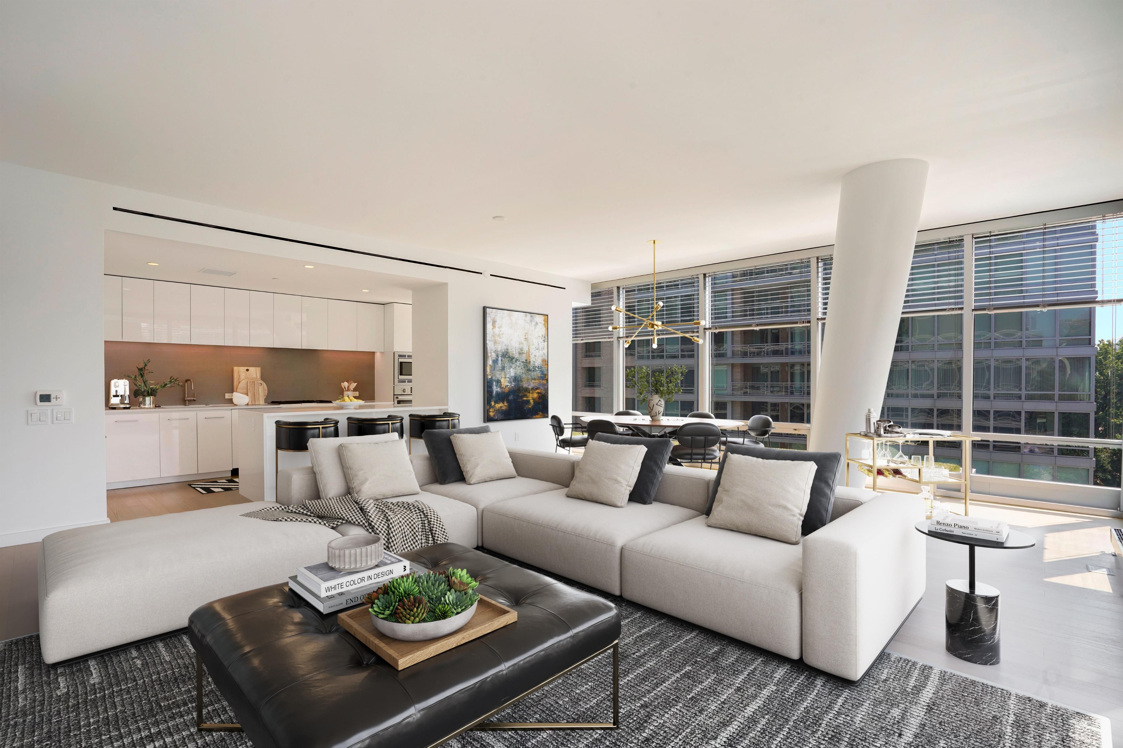 Spacious apartment living room showing kitchen